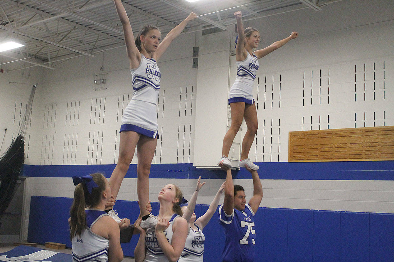 Evan Thompson / The Record — South Whidbey’s fall cheer team practices a stunt during practice on Thursday morning. The Falcons, who are the returning academic state champions, won a National Cheer Association camp this summer at the Great Wolf Lodge in Centralia.