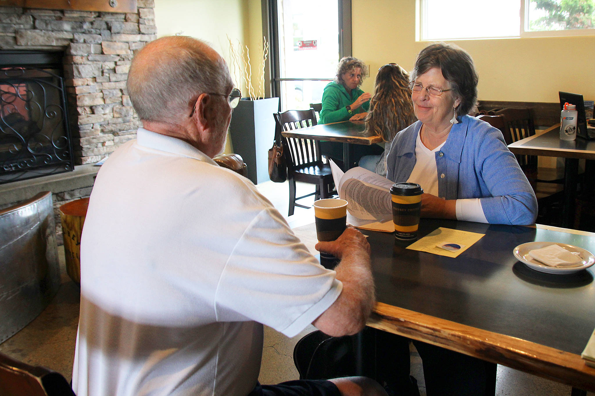 South Whidbey resident Cathy Whitmire and Oak Harbor City Councilman Jim Campbell discuss the new Civility First group at coffee Thursday morning.