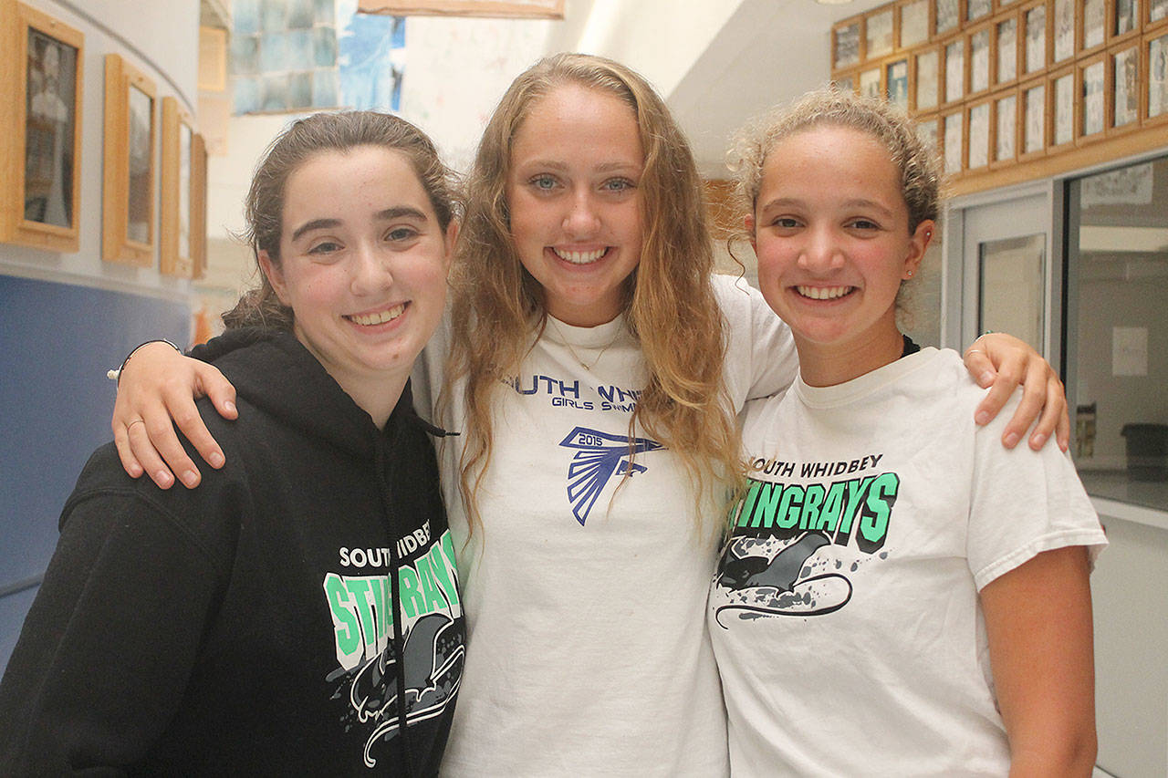 Evan Thompson / The Record — South Whidbey’s swim team will compete throughout the season alongside Kamiak High School in a cooperative agreement that was formed in 2015. The swimmers are, from left to right: Katie Zundel, Ally Lynch and Ashley Lynch.