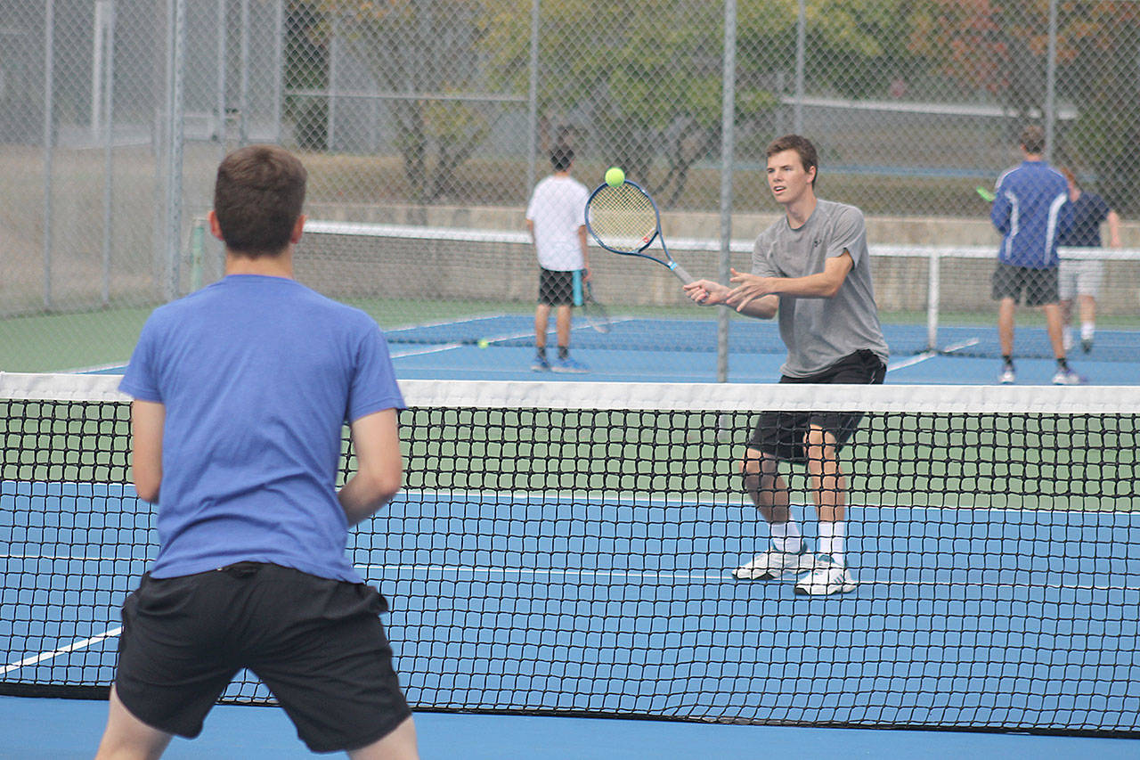 Evan Thompson / The Record — South Whidbey boys tennis tennis doubles team Ryan Wenzek (left) and Hank Papritz volley during a practice on Monday at South Whidbey High School.
