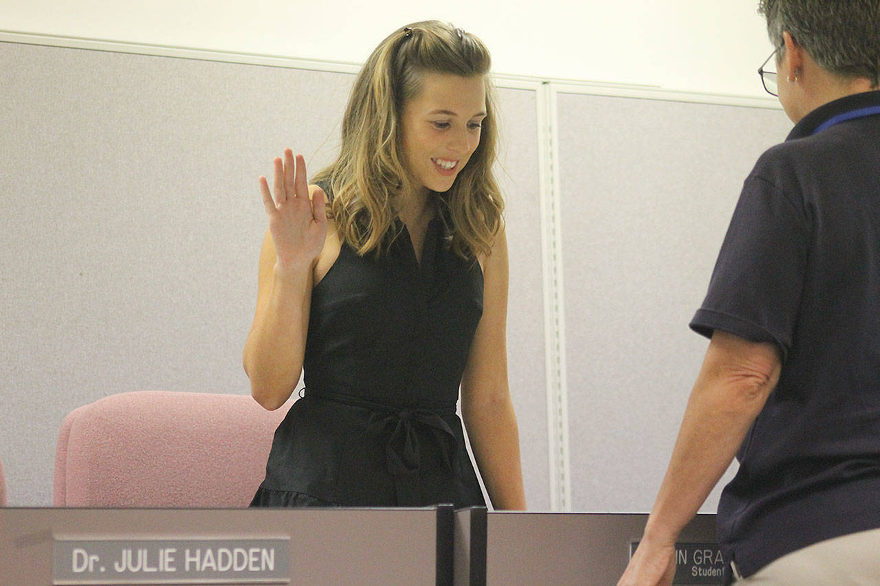 Evan Thompson / The Record — South Whidbey High School junior Erin Brewer was sworn in as student representative for the South Whidbey School Board on Wednesday night at South Whidbey Elementary School.