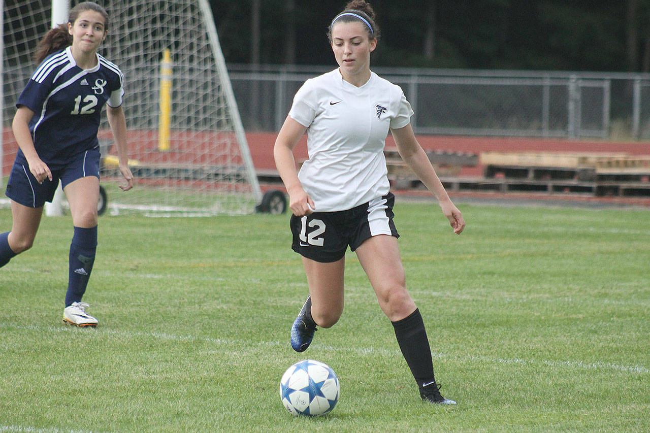 Evan Thompson / The Record — South Whidbey sophomore Karyna Hezel dribbles near the Sultan goal box. Hezel scored in the 74th minute of the contest, helping the Falcons win 6-0 on Saturday.