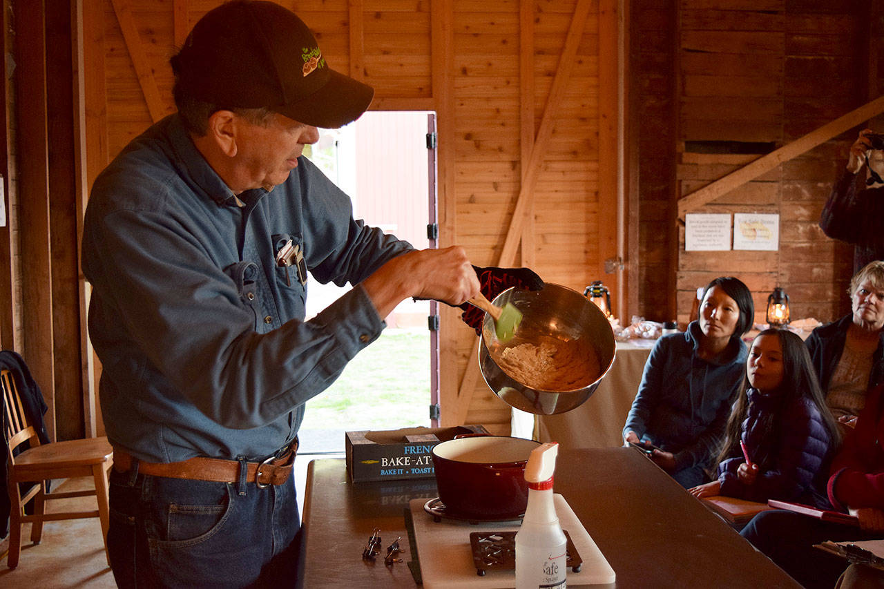 Kyle Jensen / The Record — Clinton resident Jim Hicken pours dough into a pot in front of his first class Monday night. Hicken will host four bread-making classes that run through mid-November.
