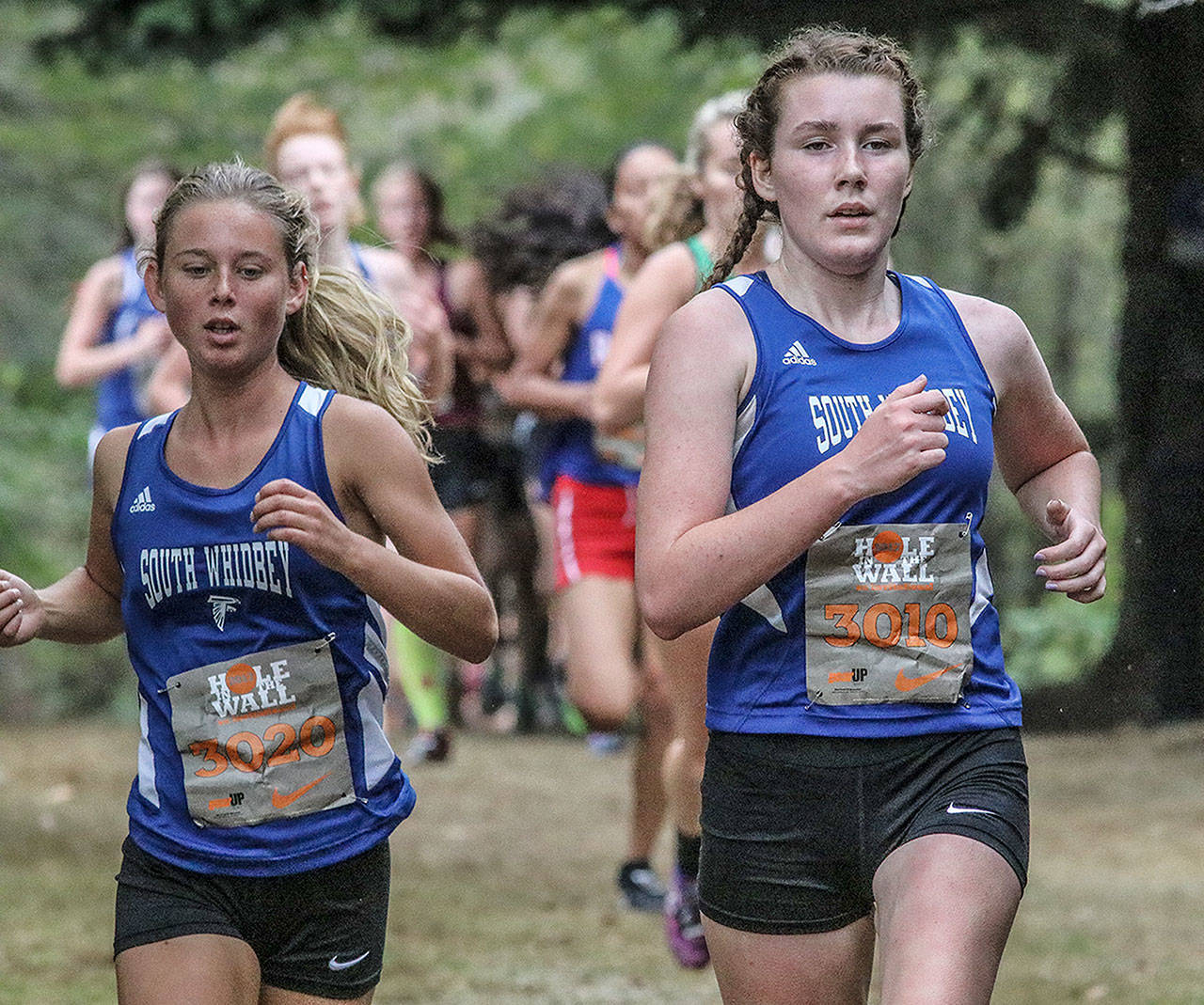 Matt Simms photo — South Whidbey junior Alexandra Kurtz (left) and senior Elizabeth Donnelly (right) finished 24th and 26th, respectively, at the Nike Hole In the Wall XC Invitational on Oct. 7 at Lakewood High School.