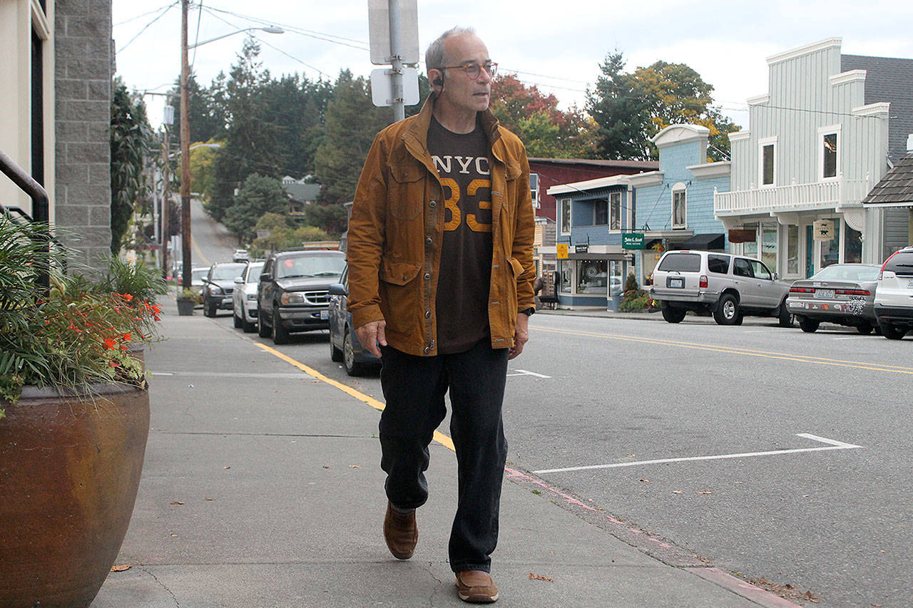 Evan Thompson / The Record — Langley resident Clyde Platt walks up First Street on his way home on Monday afternoon. First Street is set for a redesign, and Langley residents can have a say.