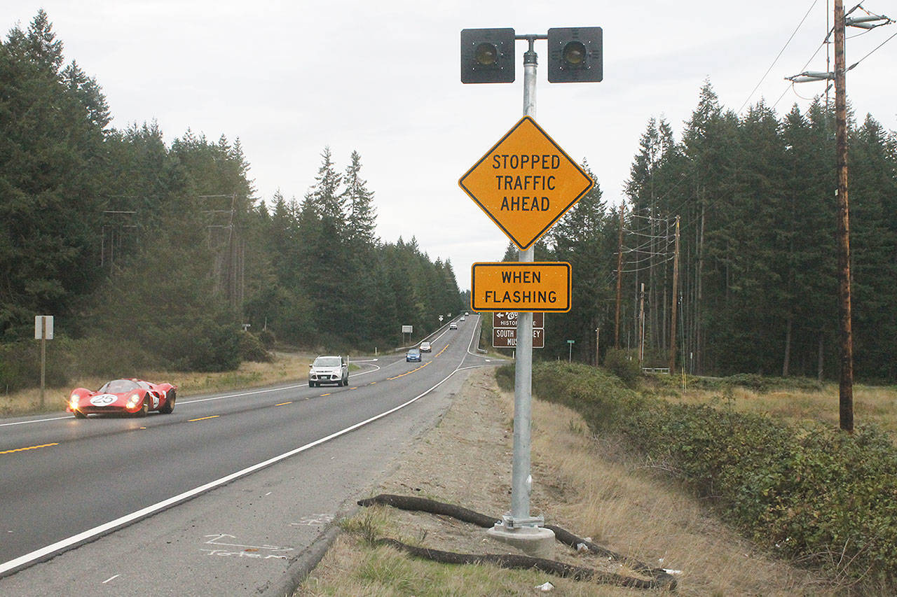 Evan Thompson / The Record — An advanced warning sign recently installed by the Washington Department of Transportation will activate whenever someone is waiting to turn left onto Coles Road.