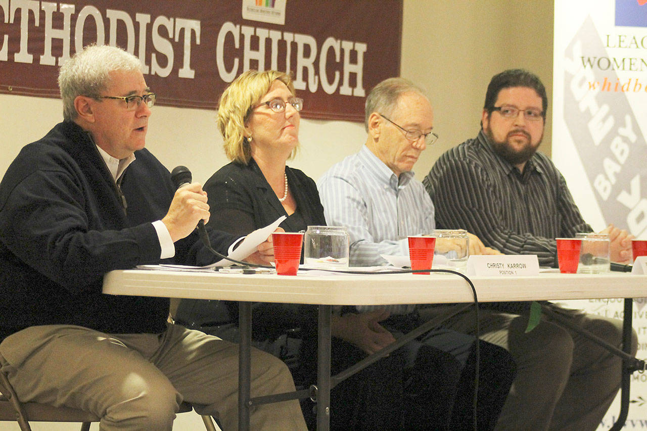 Evan Thompson / The Record &mdash; Langley City Council candidate Burt Beusch, far left, speaks at the League of Women Voters&rsquo; forum at Langley United Methodist Church on Tuesday night. From left to right: Beusch, Christy Korrow, Peter Morton and Thomas Gill.