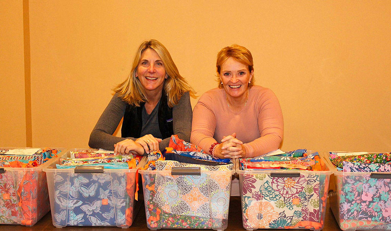 Contributed photo — Michele Bolvin (left) and Janette Skardaal (right) traveled to Malawi, Africa on Tuesday to provide feminine hygiene products to women and young girls.