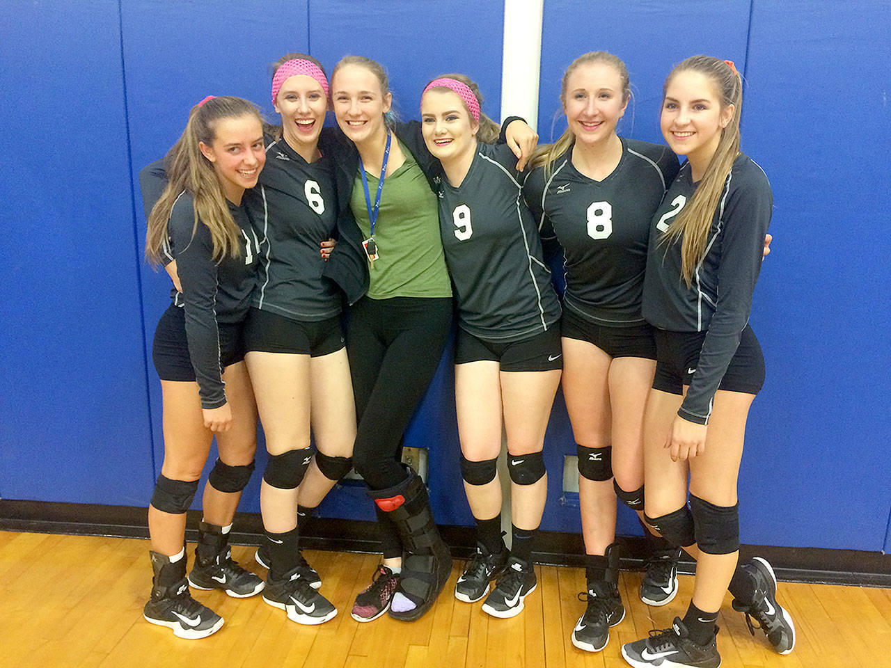 Evan Thompson / The Record — South Whidbey volleyball’s senior class pose for a photo following the Falcons’ 3-0 victory over Cedarcrest on Monday night. From left to right: Sophia Nielsen, Courtney Todd, Megan Miller, Bailey Todd, Kolby Heggenes and Rebekah Merrow.