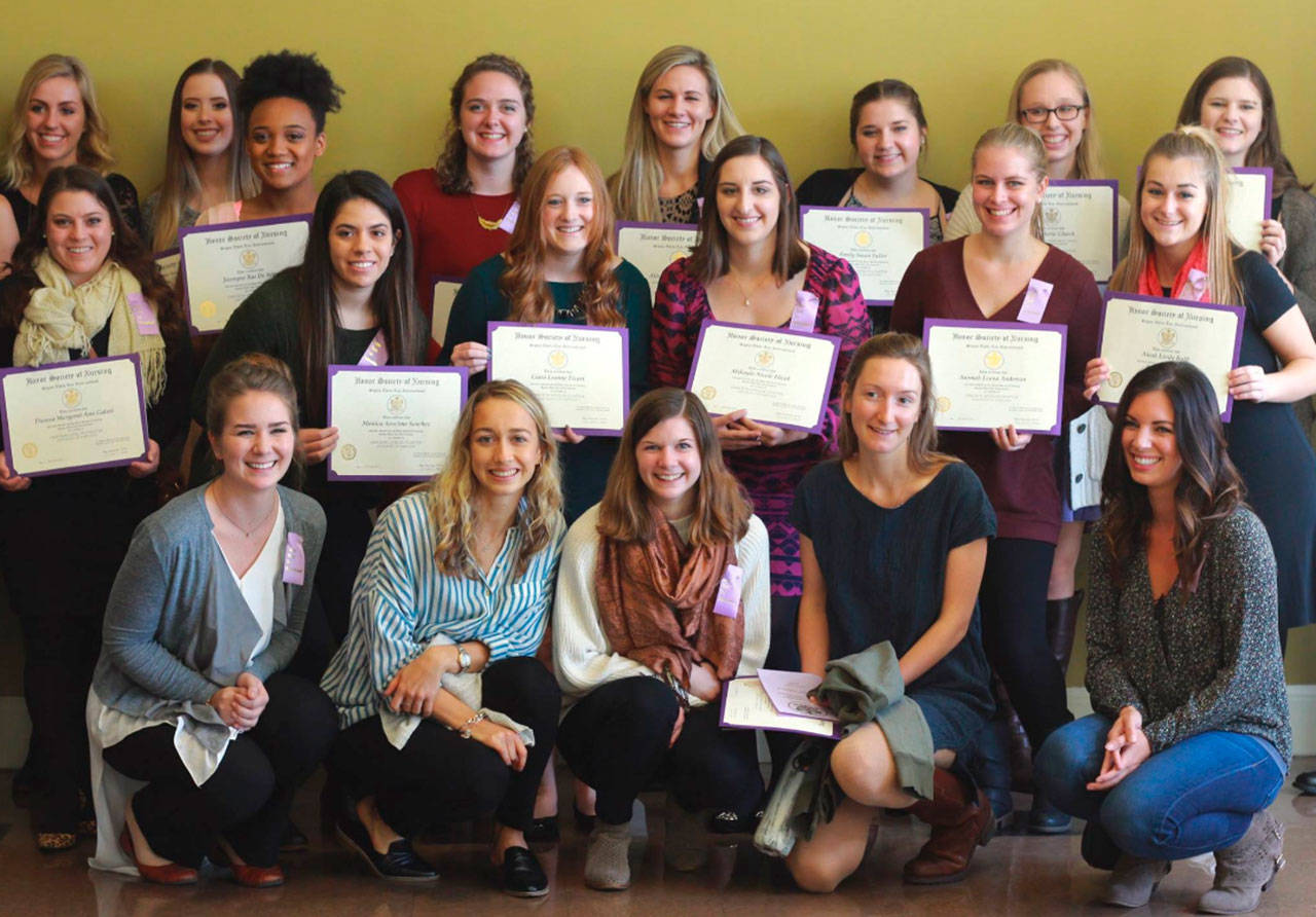 Contributed image — Sophia Nilsen (front row, far left) was inducted into the Sigma Theta Tau International Nursing Honor Society last month.