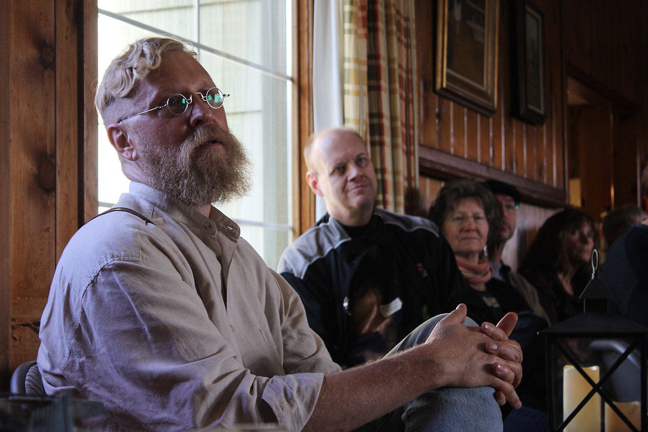 Plein air painter Brian Mahieu (far left) is spearheading the effort to bring creative types together from all over Whidbey Island. Creation is a lonely business, he told the gathering of some 80 people.