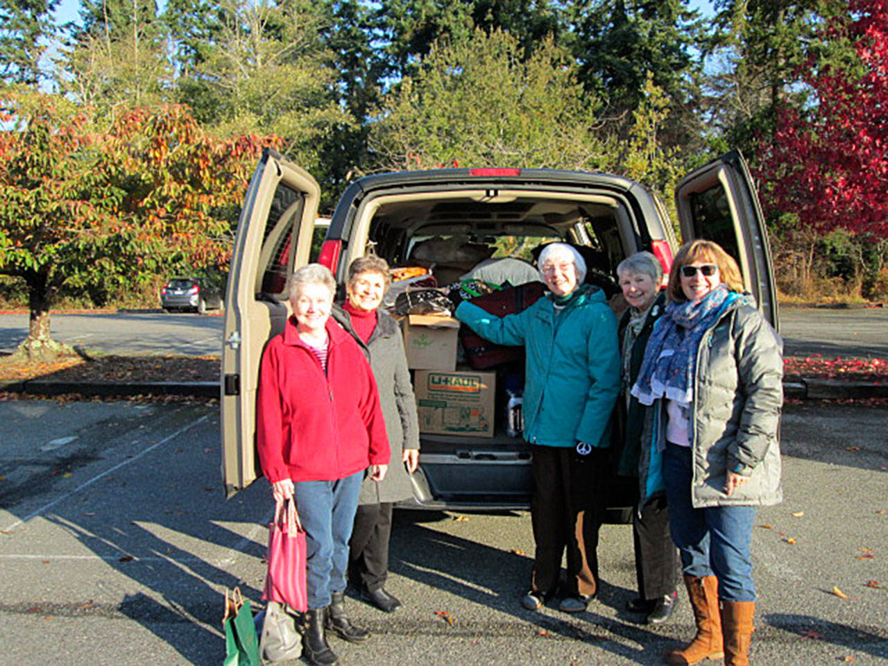 Contributed photo  Parishioners from St Hubert Catholic Church, Trinity Lutheran Church and Langley United Methodist Church collected gifts for people at Western State Hospital in time for the holiday.