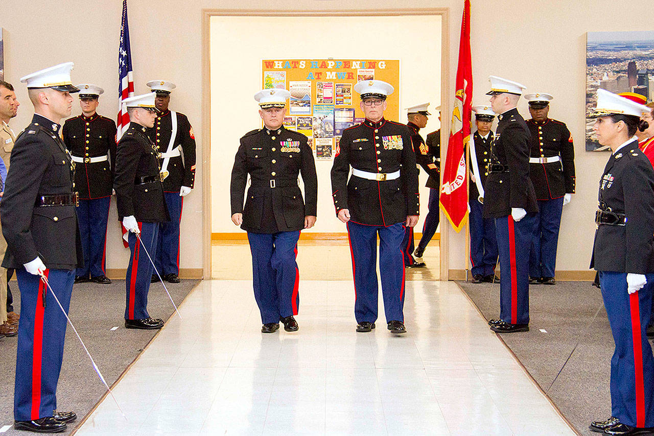 USMC photo — Jim Thompson, right, was the guest of honor at a United States Marine Corps birthday ceremony on Nov. 9 in Philadelphia, Penn. To the left of Thompson is his son, Chandler, who is a first lieutenant and readiness officer at the NAVSUP Weapon Systems Support base.