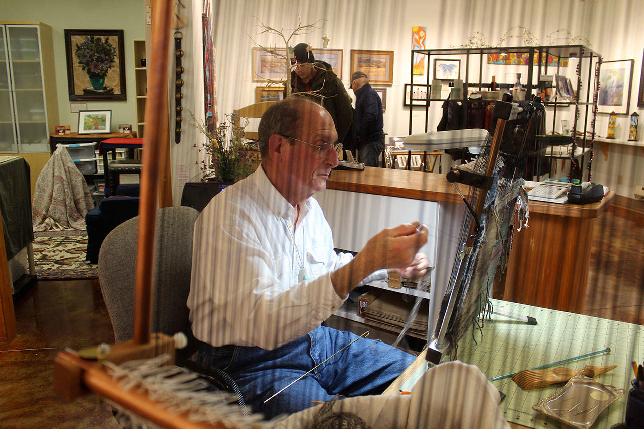 Windwalker Taibi works on his small weavings Friday while minding Raven Rocks Gallery at Greenbank Farm. He and other business owners will join the Port of Coupeville Saturday during We Bought the Farm activities. Photos by Patricia Guthrie/Whidbey News-Group