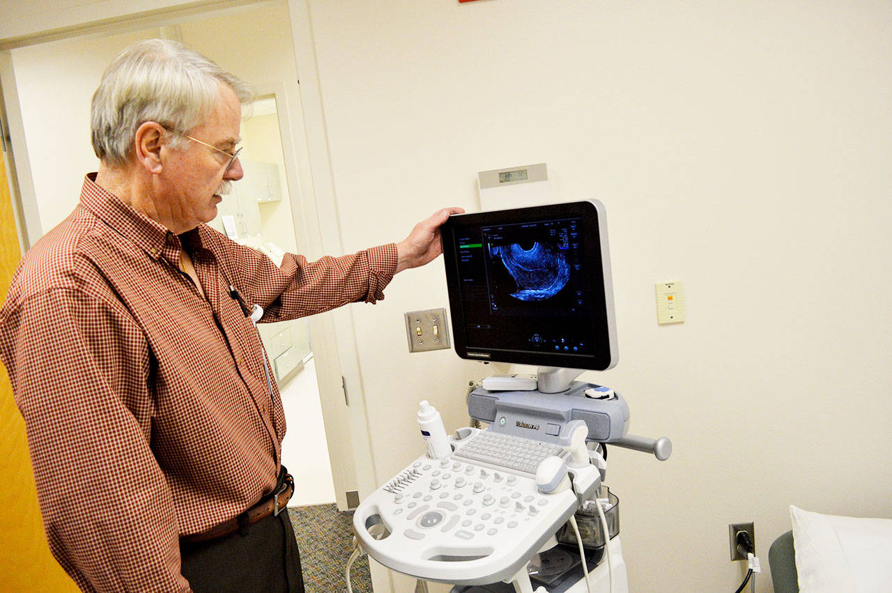 Dr. Robert Burnett examines an ultrasound image at the new WhidbeyHealth Women’s Care clinic located on Golide Road in Oak Harbor. This is the first women’s health clinic the hospital has had in the city. Photo by Laura Guido/Whidbey News-Times