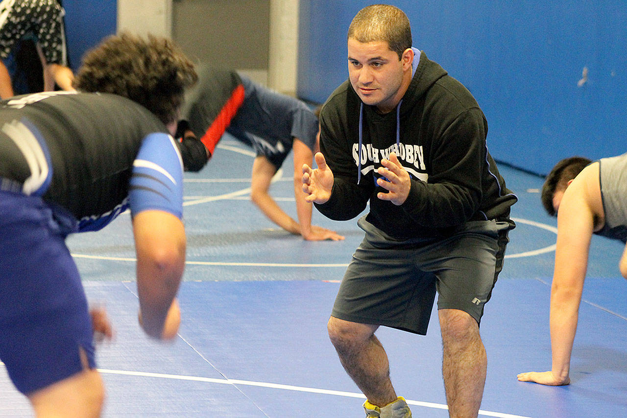 Evan Thompson / The Record — South Whidbey wrestling coach Robbie Bozin teaches technique at a recent practice. Bozin replaced former coach Jim Thompson as the Falcons’ new coach.