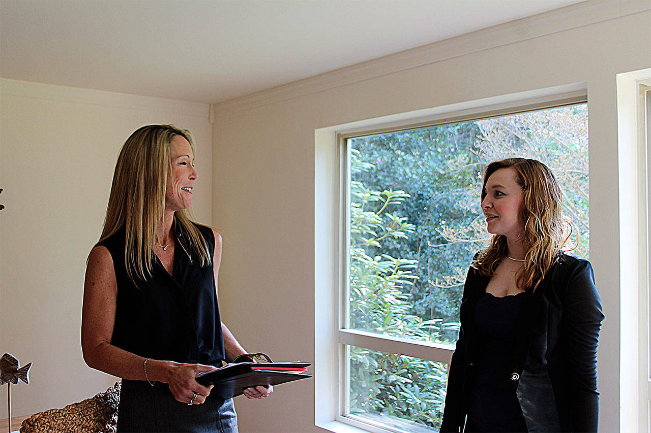 Record file — Windermere realtor Dana Hezel shows a prospective buyer a house in Langley in 2016.