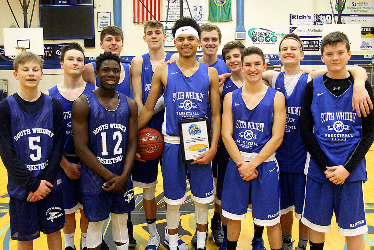 Evan Thompson / The Record — South Whidbey’s boys basketball poses for a photo after returning from San Diego, Calif. The Falcons finished second in the 2017 Surf ‘N Slam Tournament from Dec. 28-30 at Scripps Ranch High School.