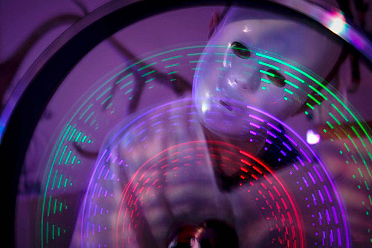 Aaliyah Kois photo  The exhibit, organized by South Whidbey artist KeKe Cribbs, encourages guests to toy with lights, props and darkness to snap creative photos. This photo, using projected lights and a bicycle wheel, was captured by 11-year-old Aaliyah Kois.