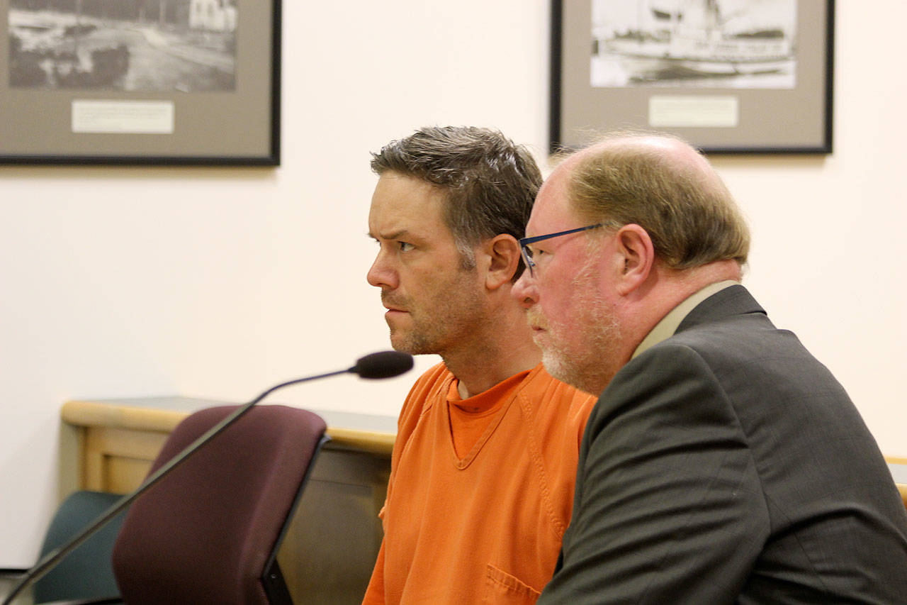 File photo                                Blake Fountain appeared in court last year with attorney Craig Platt. Fountain is accused of starting a fire that burned down two houses on South Whidbey.