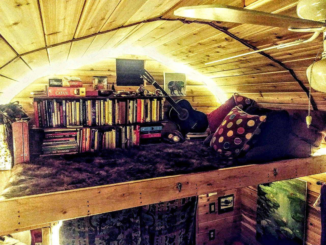 Contributed photo  Though small compared to normal sized houses, tiny homes offer flexibility and design creativity. The loft of a tiny home in Olympia is used for both sleeping space and a book shelf.