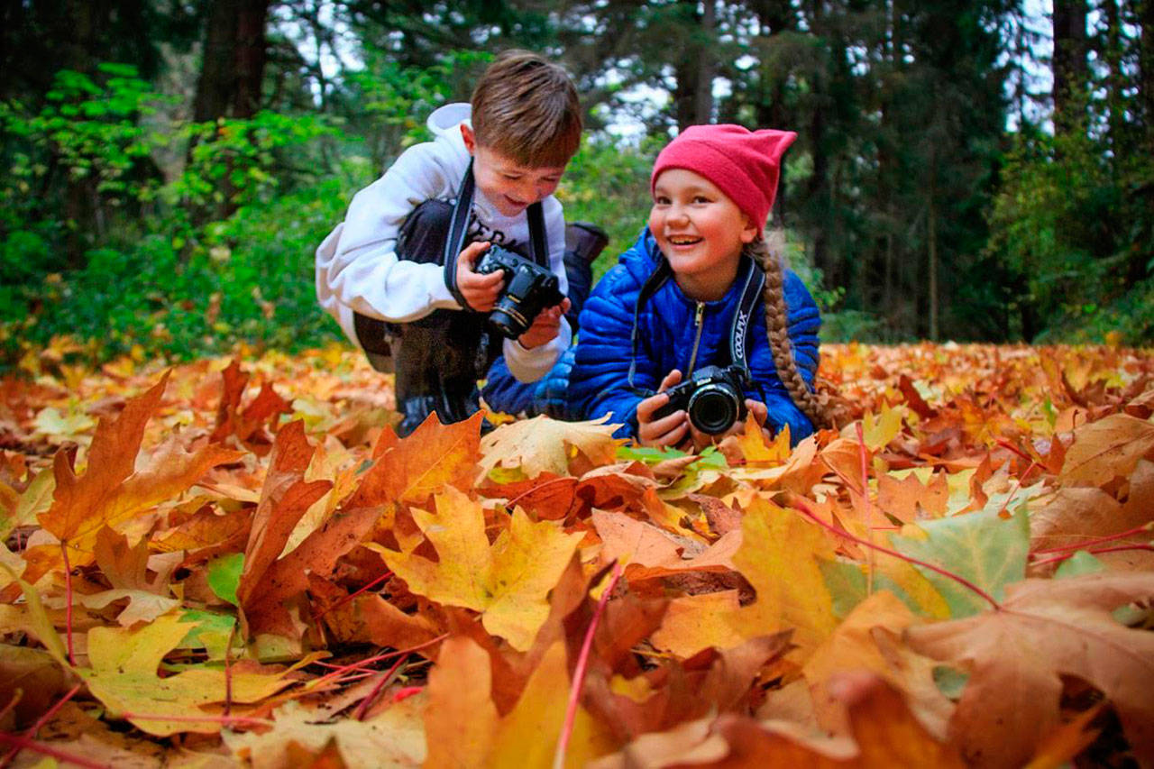 Tasa Mungarro-Eberhart (left) and Arcani Robinson spent a couple months photographing their worlds for an assignment of Calyx School. A reception of their work and student Aaliyah Kois Jacob is 11:30-1 p.m. Sunday at Bayview Cash Store. Photo provided by David Welton