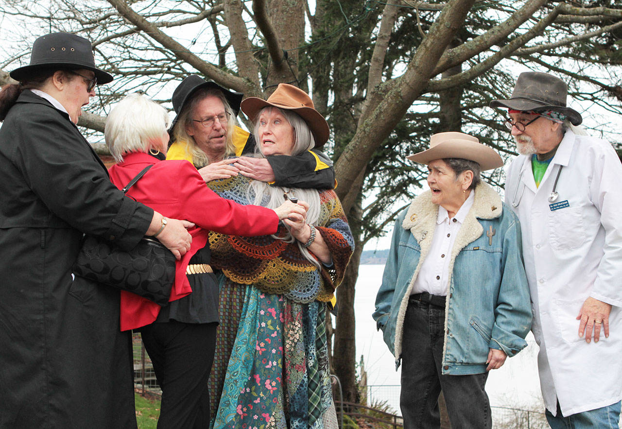 At the scene of the murder of merlin Mariner at Whale Bell Park, Officer Polly Graph and Ashford Gris break up a fight between the murdered mans fiancé Goldie Digger and his estranged wife Rainy Gray. Detective I.B. Fuzz and Coroner Gus Gruesome, right, are shocked. Photo by Kramer OKeefe.