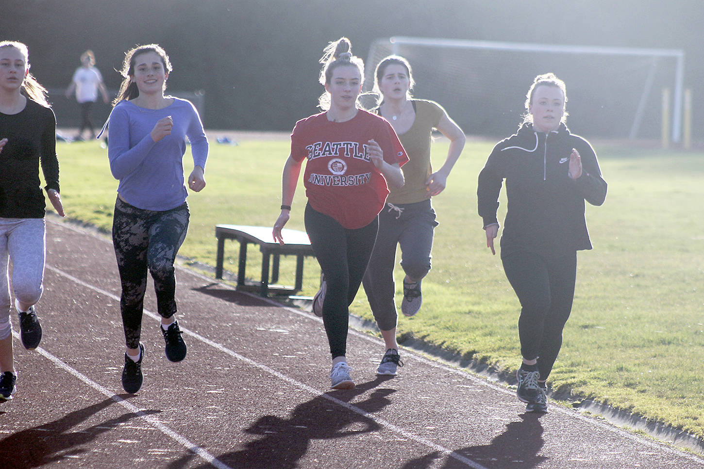 Evan Thomspon / The Record                                South Whidbey track and field athletes practice sprinting on Thursday afternoon. From left to right: Serena McLain, Leanne Robbins, Sophia Nielsen, Grace Complita and Mikayla Hezel.