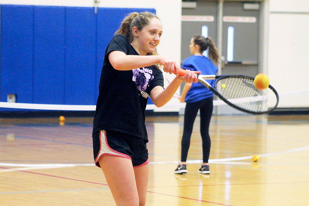 Evan Thompson / The Record — South Whidbey senior Ally Lynch hits a nerf ball during a practice moved indoors because of rain Wednesday.