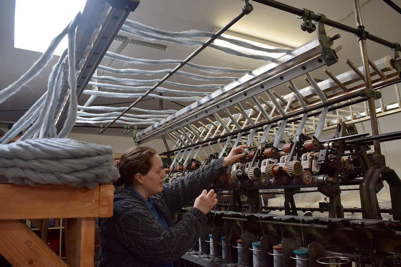 Lydia Christiansen works in her fiber mill in May 2017. Last month, most of her inventory was stolen while traveling to a trade show in California. Record file photo/2017.