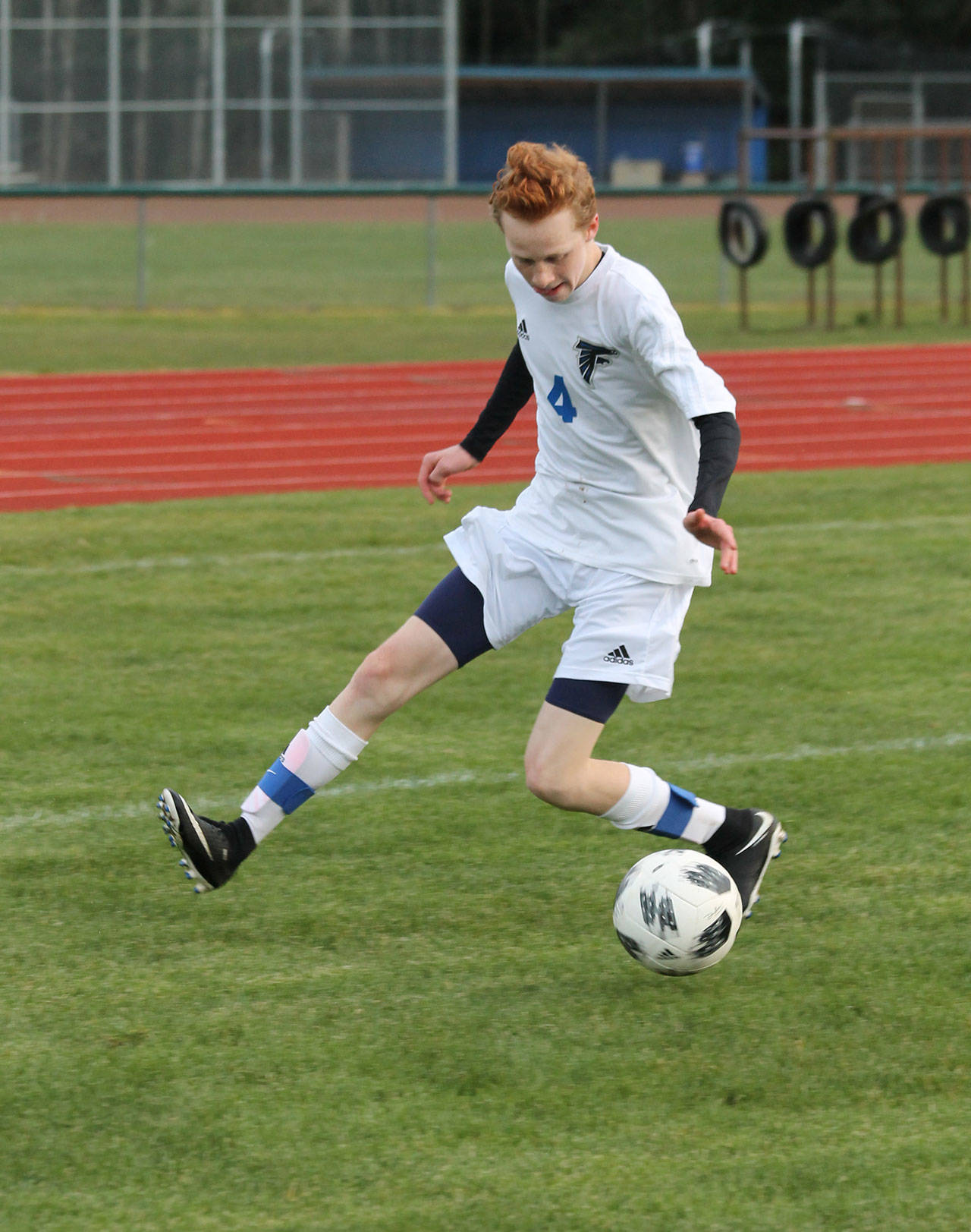 Reilly McVay runs down the ball for the Falcons in the King’s match Friday.(Photo by Jim Waller/Whidbey News Group)