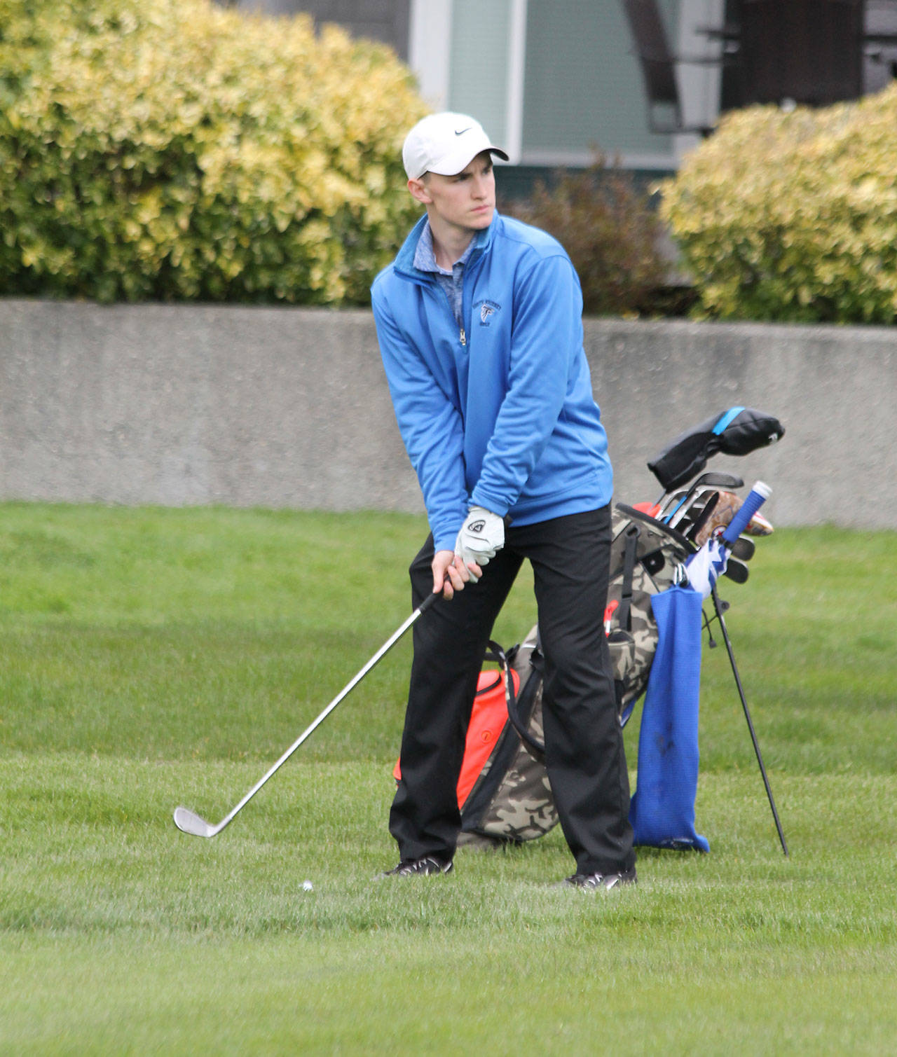 Ryan Wenzek checks out a shot in Monday’s match with Cedar Park Christian. Wenzek finished second by one stroke.(Photo by Jim Waller/Whidbey News Group)