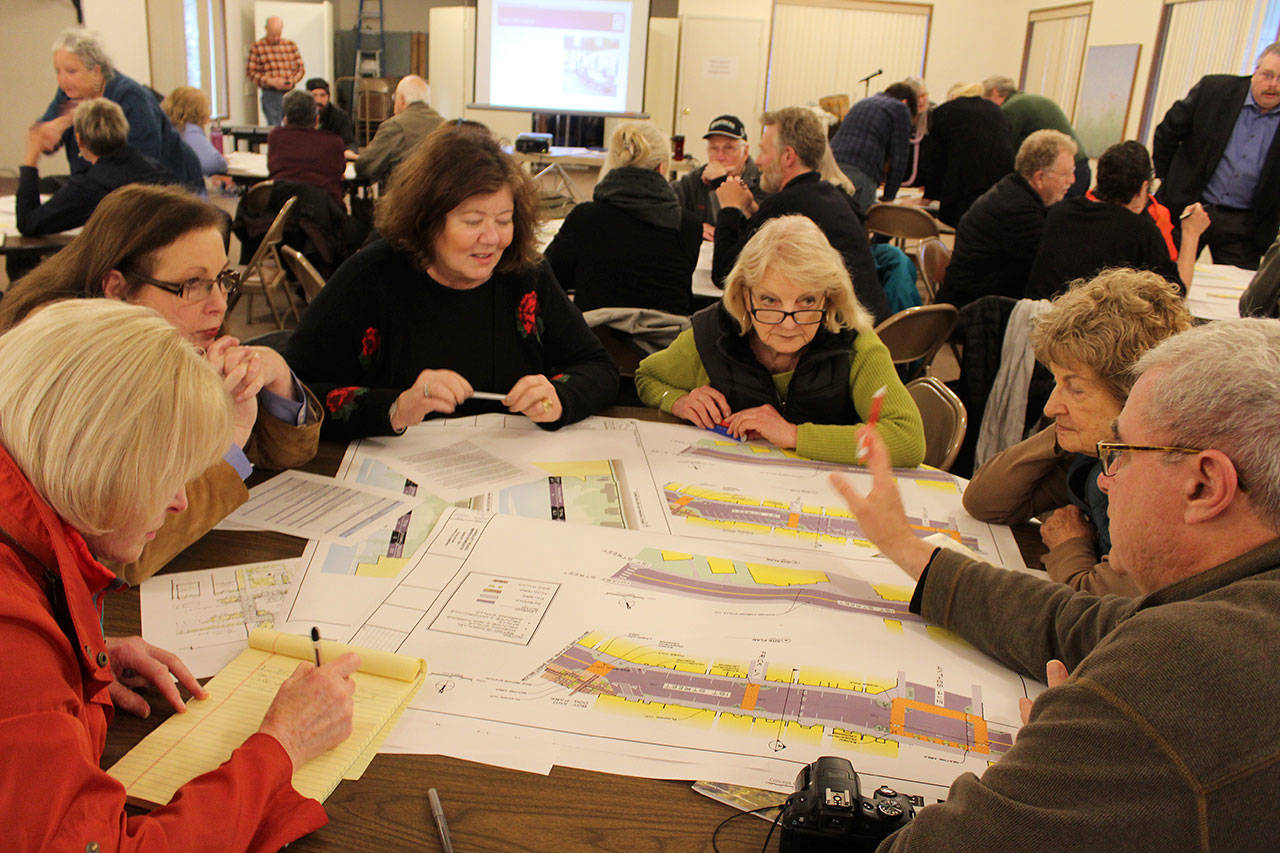 Langley residents look over different proposals for reconfigured parking along First Street at a public forum Wednesday night. Photos by Patricia Guthrie/Whidbey News Group