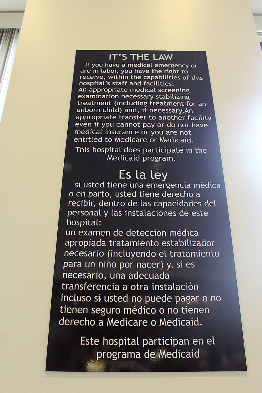 WhidbeyHealth has installed signs too big to miss explaining it must help individuals in medical distress or women in labor under federal law. The large black signs with white lettering replace much smaller notices that were not well seen by the public. Photo by Patricia Guthrie/Whidbey News Group