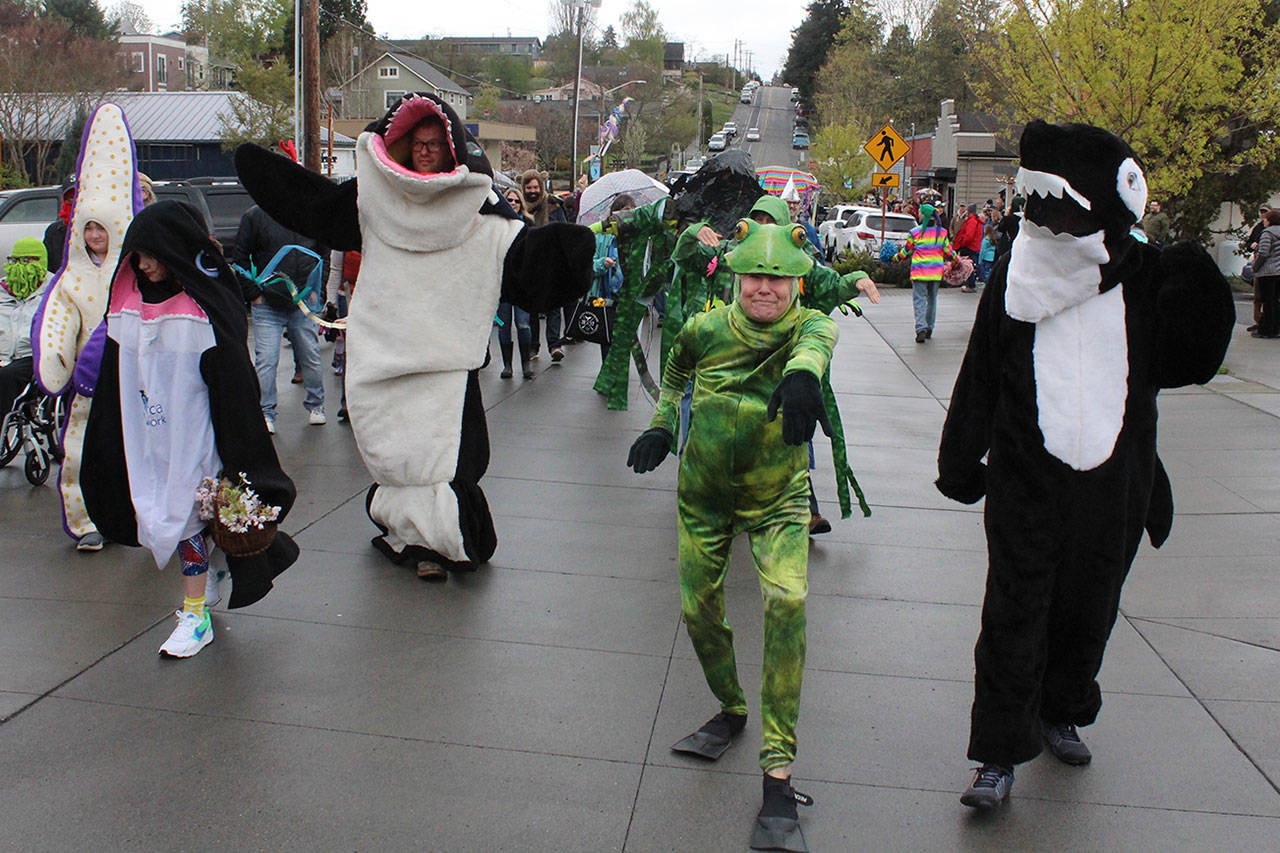 Welcome the Whales Parade and Festival Saturday in Langley featured lots of kids in brightly-colored critter costumes with many adults joining in the annual tradition, including Gail Fleming who likes to wear a frog suit. Photo by Patricia Guthrie/Whidbey News Group