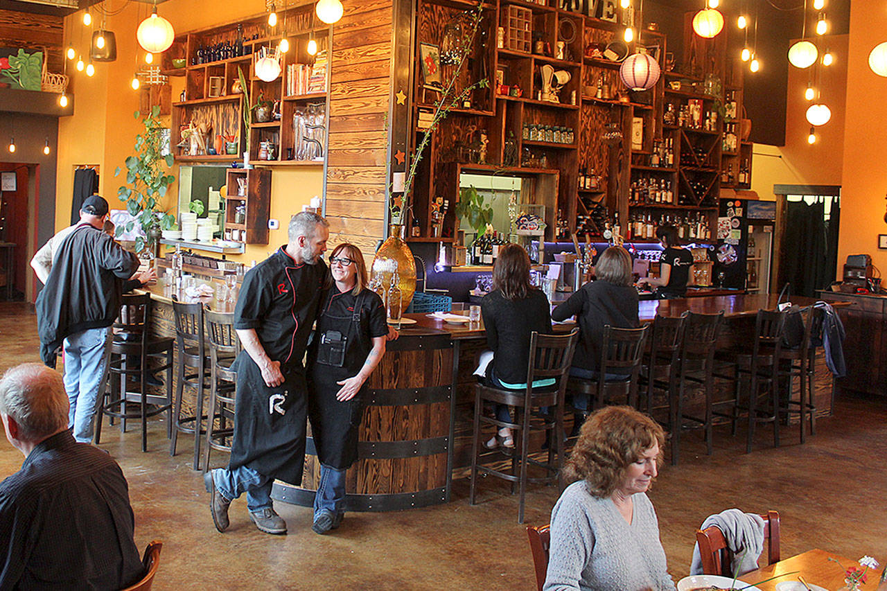 Roaming Radish owners J.P. and Jess Dowdell stand in the center of their gastropub open only three nights a week. Theyve been in the catering business many years and arent too worried about serving a few dozen travel, food and wine writers Tuesday evening. Were excited to showcase Whidbey, said Jess Dowdell.Photo by Patricia Guthrie/Whidbey News Group