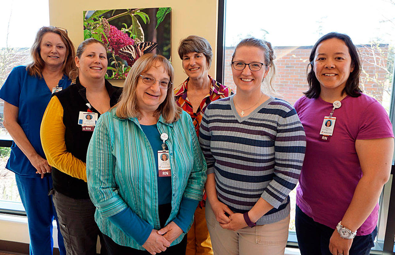 WhidbeyHealth nurses trained to assess victims of sexual assault are left to right: Jackie Blankenship, Rebecca Pina, program manager Jackie Bassett, Jacqueline Moore and Sherry Phay. Cynde Robinson, director of Coalition against Domestic Violence, is in the back row. Team member nurses Krista Burckhardt, Gayle Wallen and Tonya DeYoung were unavailable for the photo.