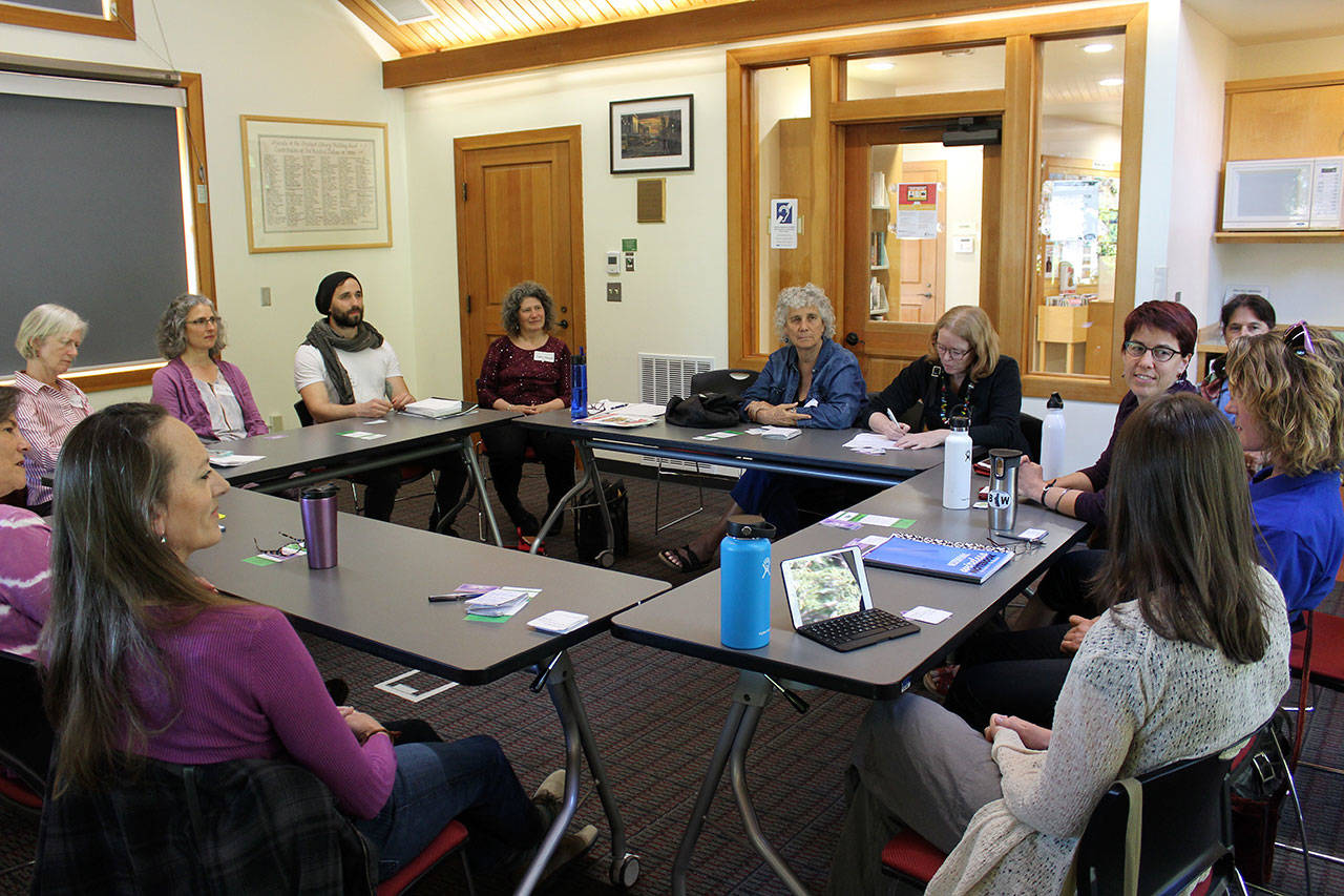 Members of Whidbey Island Holistic Health Association meet at the Freeland Library to learn about government strategies to reduce opioid prescriptions and help people with long-term pain. Photo by Patricia Guthrie/Whidbey News Group