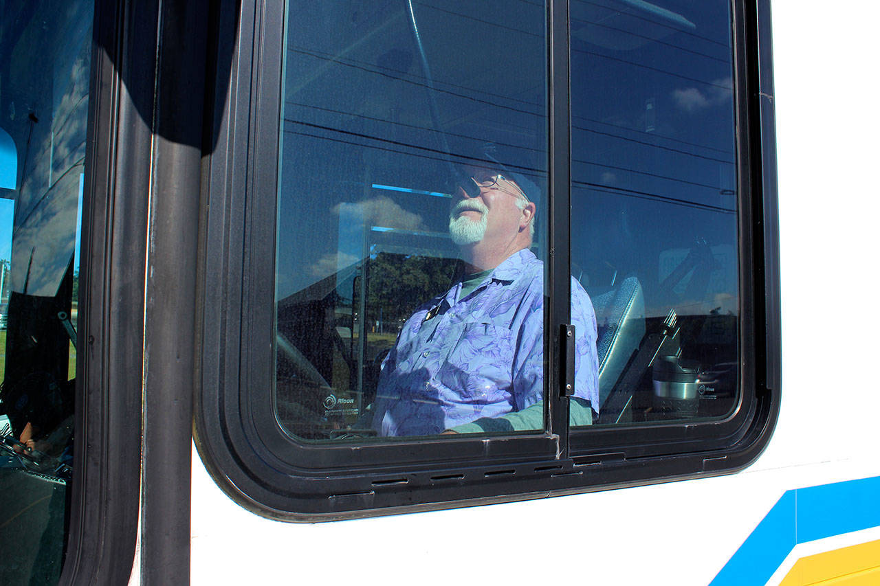 Island Transit bus driver Dana O’Blenes gets ready to pull away from a stop. Photo by Patricia Guthrie/Whidbey News Group