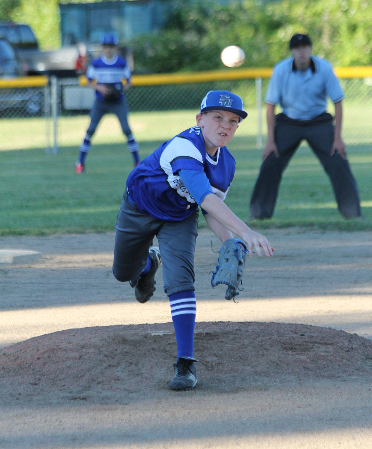 Maddox Smith-Heacox delivers a strike for South Whidbey.(Photo by Jim Waller/South Whidbey Record)