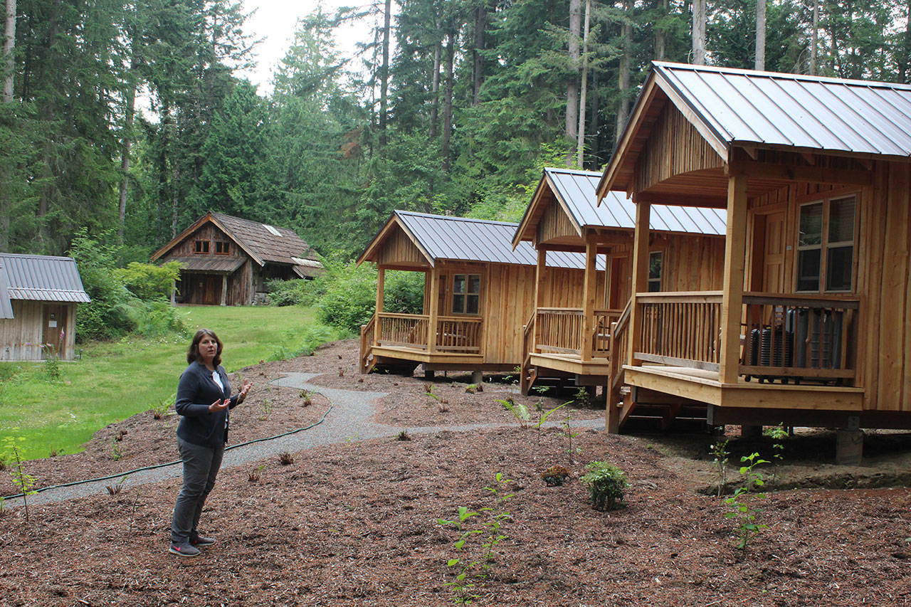 Holly Harlan, program director at Whidbey Institute, talks about how new cabins will help the retreat learning center bring in needed income.Photo by Patricia Guthrie/Whidbey News Group