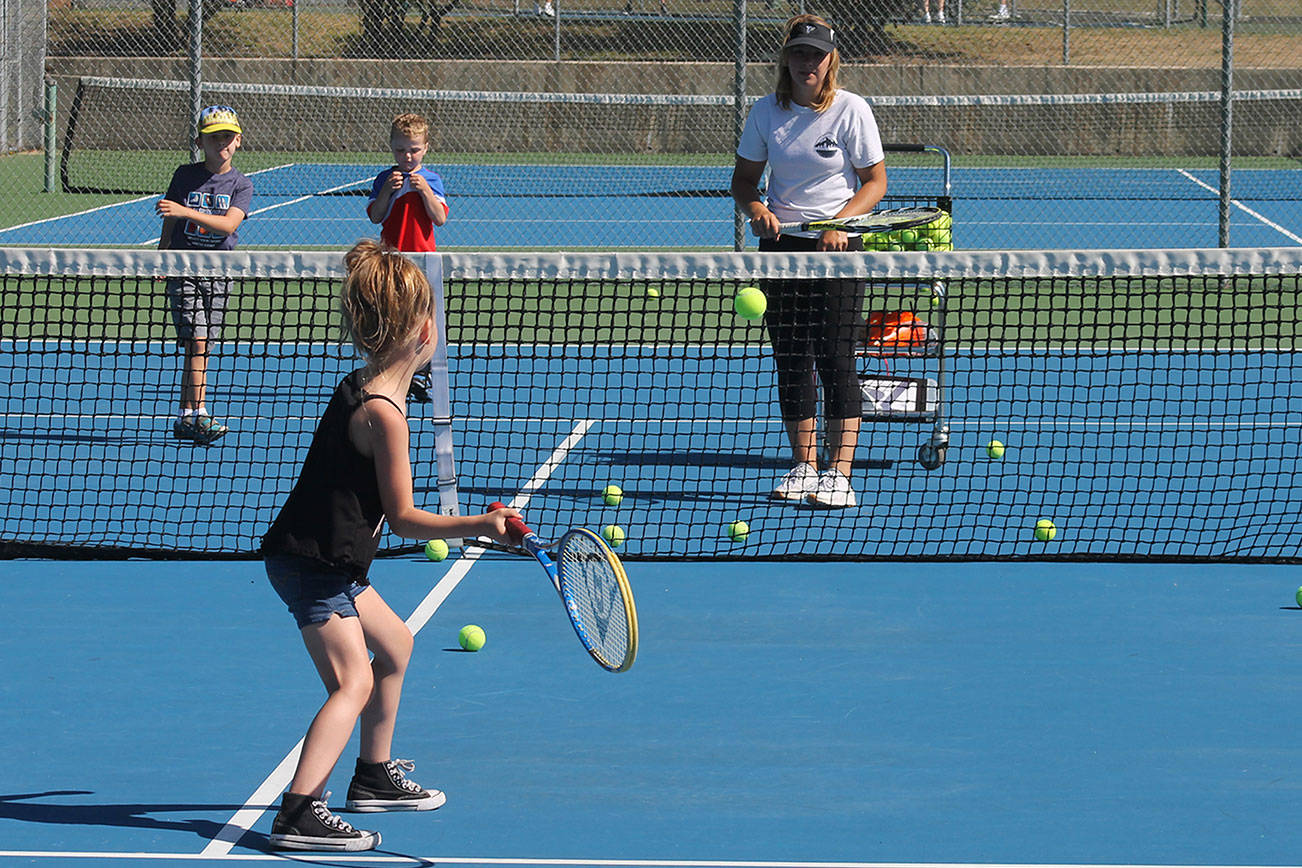 Foode leads kids in Parks and Rec tennis camp