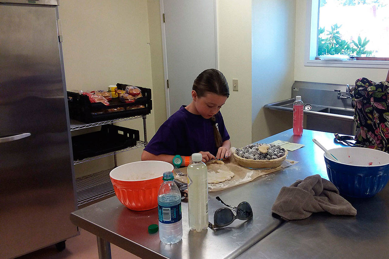 Madison Thompson used the Coffman Kitchen Saturday to make blackberry pie for the 4-H pie baking contest during the recent Whidbey Island Fair. Photo provided