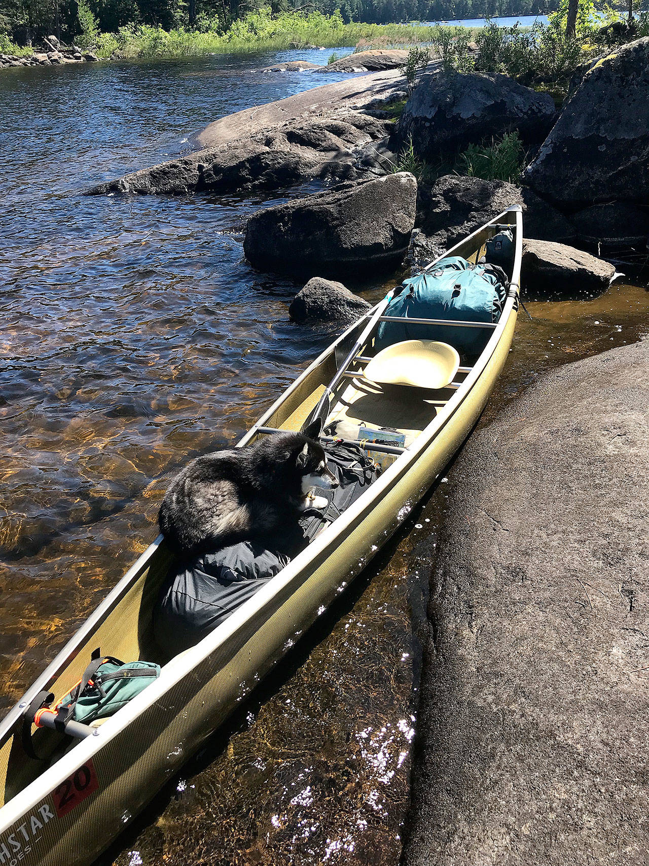 Photo by Jim Christensen                                The rented canoe is hauled ashore at a stopping point.