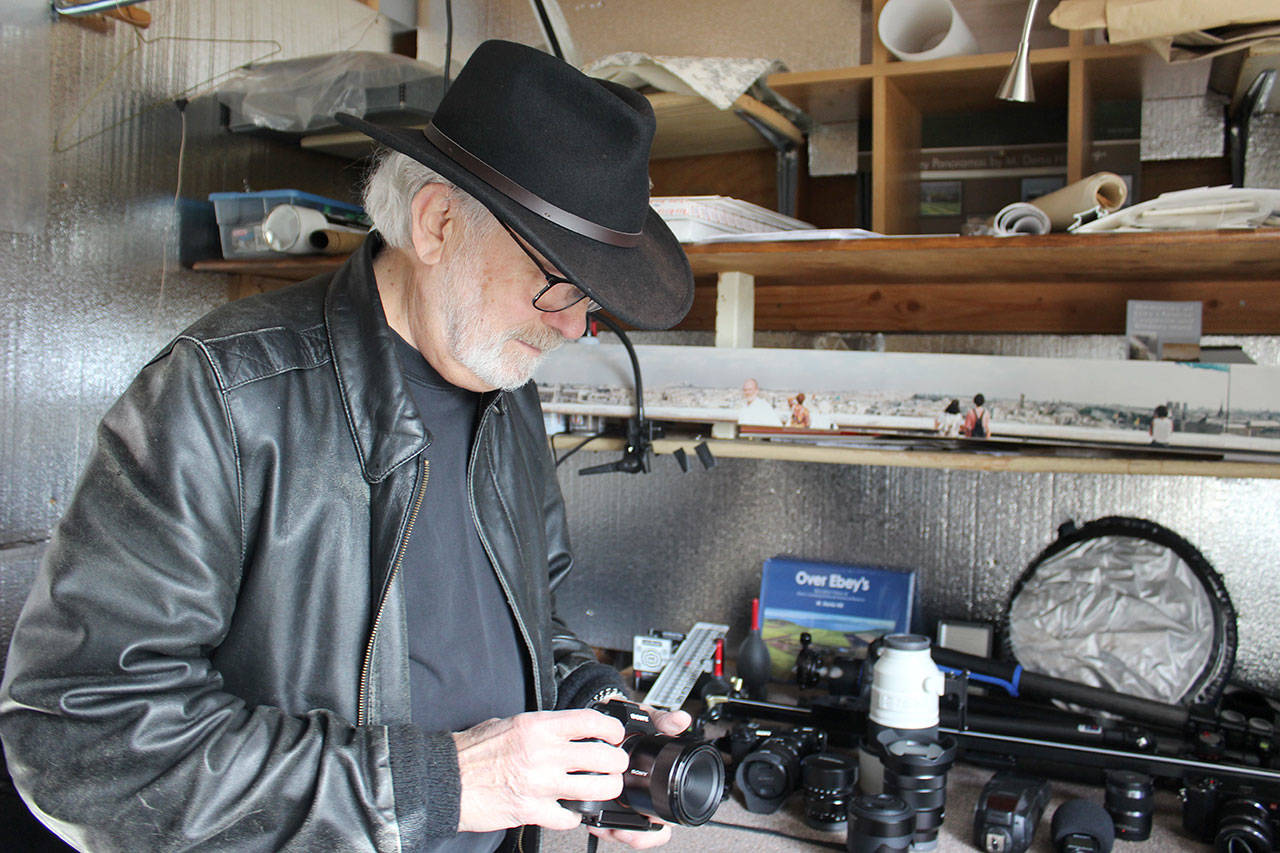 Coupeville photographer Denis Hill, known for his panoramic images of Ebey’s Landing National Historical Reserve, is also part of the 15th Annual Summer Open Studio Tour. (Photo by Patricia Guthrie/Whidbey News Group)&lt;address&gt; &lt;/address&gt;