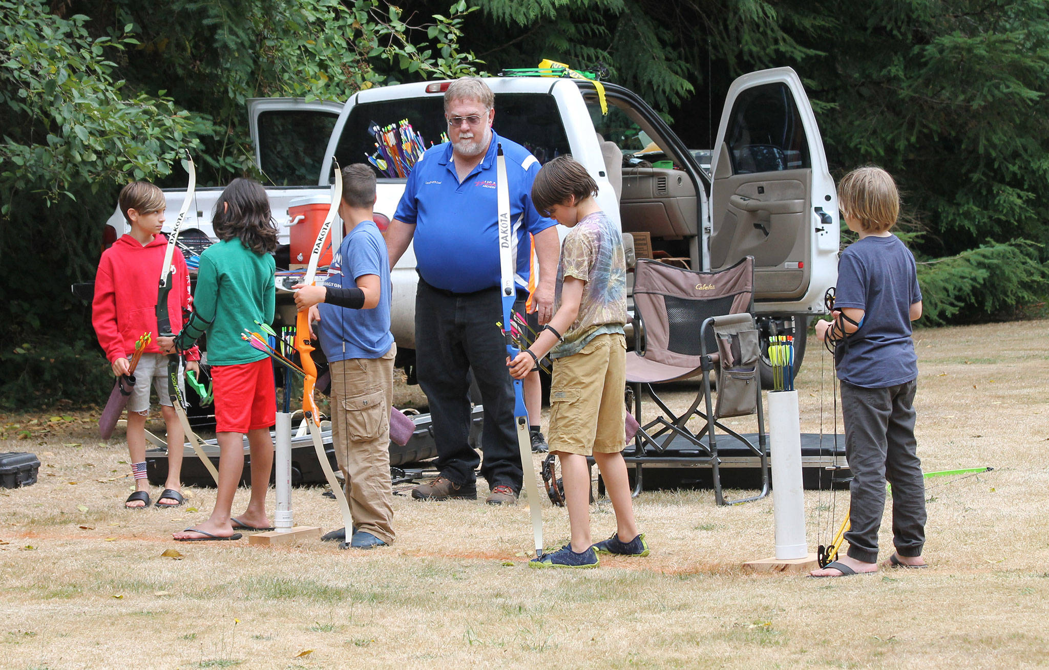 Bill Stinson instructs the group as they begin archery camp last Thursday.(Photo by Jim Waller/South Whidbey Record)