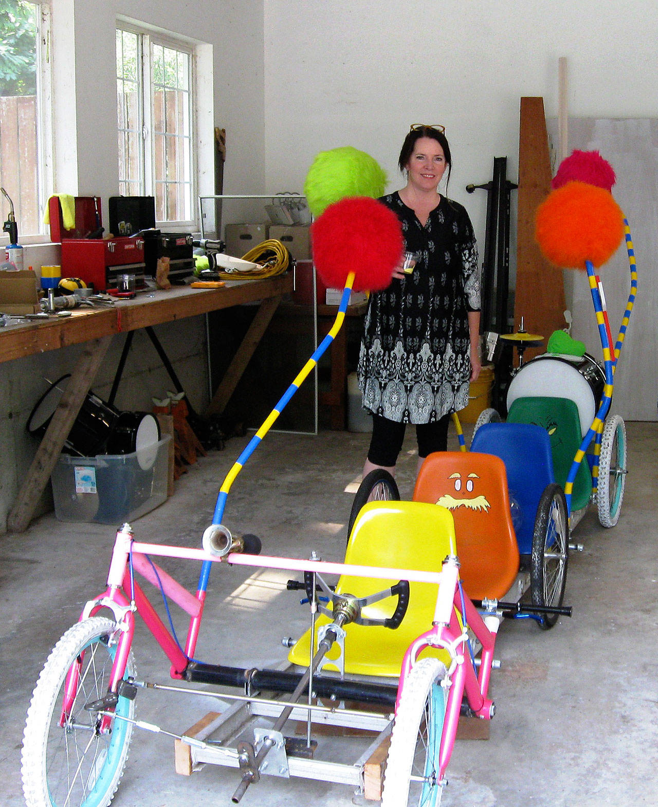 Photos by Dave Felice                                Langley resident Michaleen McGarry works on a Soup Box Derby car she is building with her husband Brian Dunnington, along with Robin Black and her husband Tim Callison. This is an ambitious 6-wheel, 4-seat vehicle with a Dr. Seuss theme.