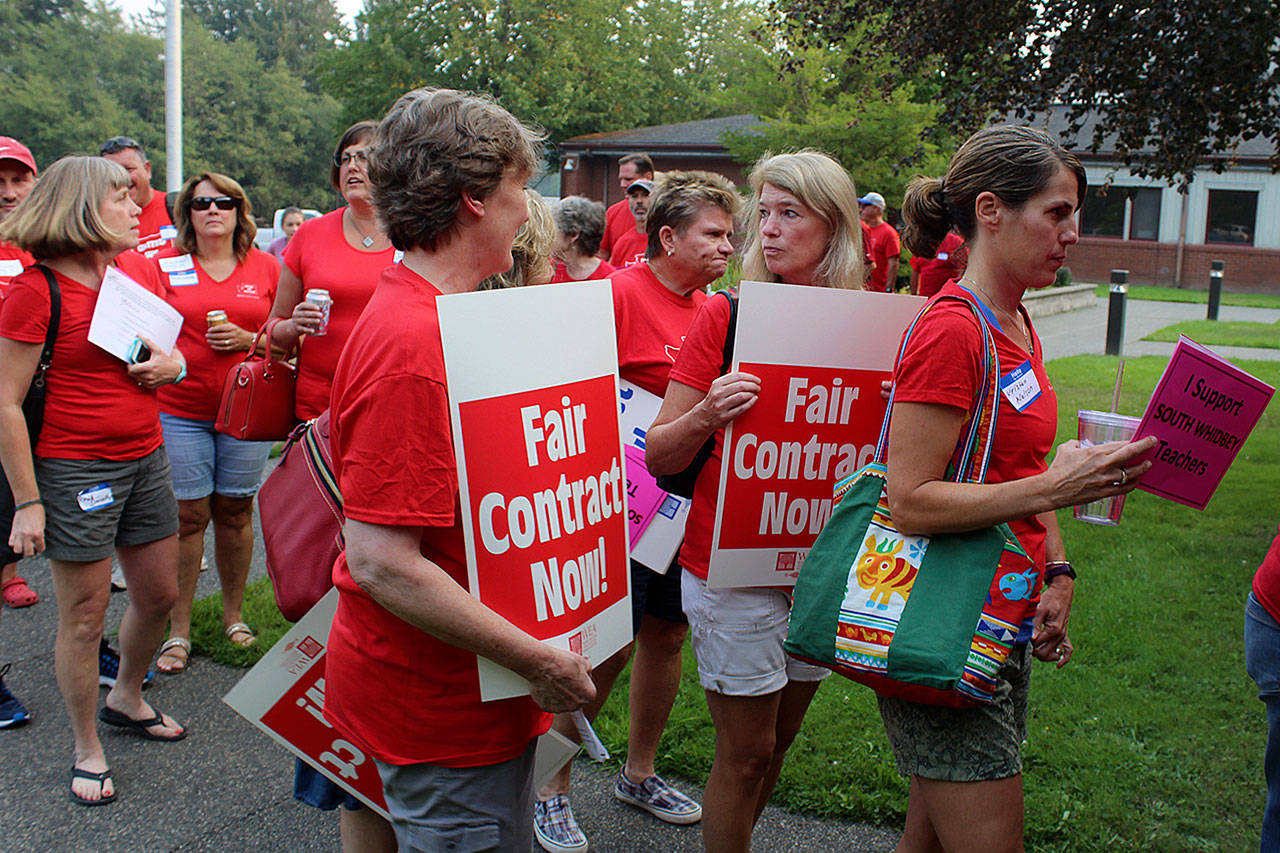 Teachers rallied at a board meeting of the South Whidbey School District demanding a salary increase in line with other school systems around the state. (Photo by Patricia Guthrie/Whidbey News Group)