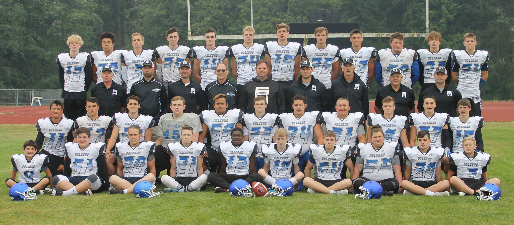 The 2018 South Whidbey football team  Front row, right to left: Tyler Thrasher, Erik Haugen, Shelby Campbell, Justin Moberly, Dominick Anderson, CH Chapman, Billy Rankin, Tasman Dussault, Joey Mattson, Anthony Hall.Second row: Ryan Morgan, Dexter Jokinen, Bodie Hezel, Brandon Thrasher, Kobe Balora, Caden Spear, Larry Harrera, Cody Woolcock, Clay OBrien, Cameron Martin, Alex Black.Third row: coaches Shane Thrasher, Grandpa Hodson, Andy Davis, Luke Hodson, Mark Hodson, Jim Thompson, Sean Spear, Leo Langer, Bob Hezel.Back row: Aiden Coleman, Aidyn Frederick, Lewis Mattson, Dayton Birchfield, Cody Eager, Kole Nelson, Wyatt DeMers, Brady Hezel, Kieran Birchfield, Kody Newman, Zane Balora, Kaidyn Brinks. (Photo by Jim Waller/South Whidbey Record)