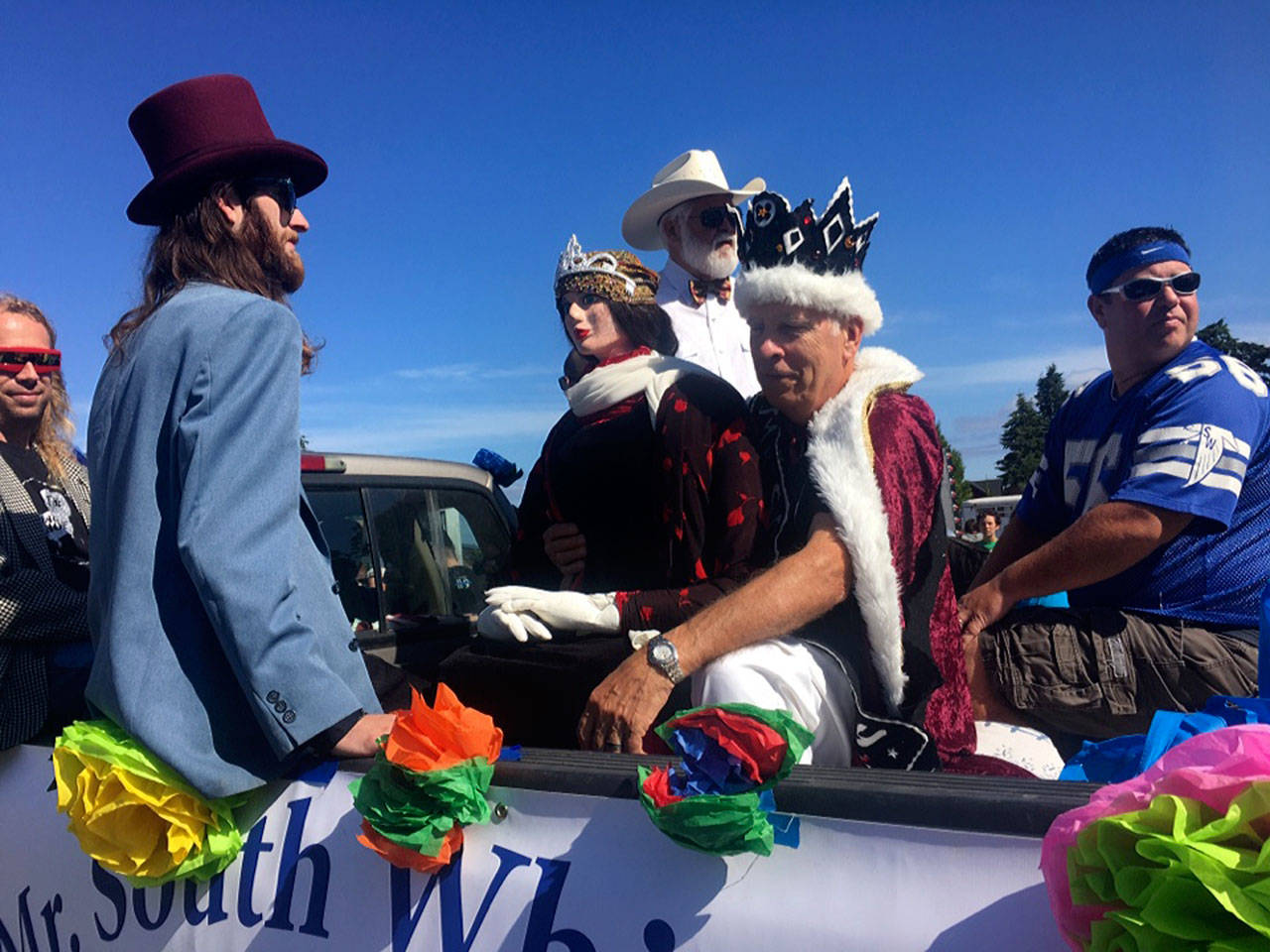 Mr. South Whidbey 2017, Daniel Goldsmith, takes a ceremonial ride with some of this year’s contestants during the Whidbey Island Fair parade. He’s surrounded by Tim Leonard, far left, Keegan Harshman, left, Ray Green, center, and Trace Prael, right. (Photo provided)
